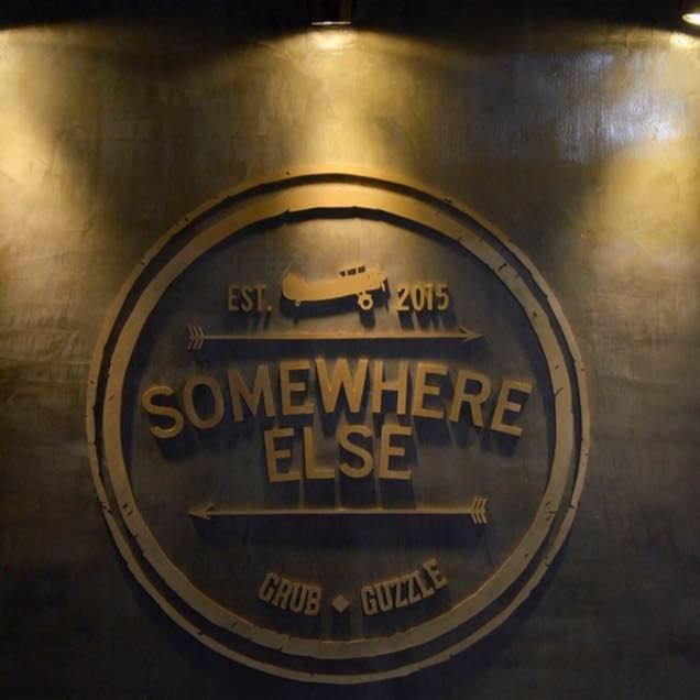 somewhere else signage