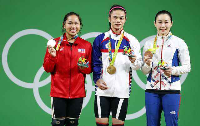 Image Source | Rappler.com Hsu Shu-ching (C) of Taiwan poses with her gold medal on the podium after winning the women's 53kg category of the Rio 2016 Olympic Games Weightlifting events at the Riocentro in Rio de Janeiro, Brazil, 07 August 2016. Hsu Shu-ching won ahead of second placed Hidilyn Diaz (L) of the Philippines and third placed Yoon Jin-hee (R) of South Korea.  EPA/NIC BOTHMA