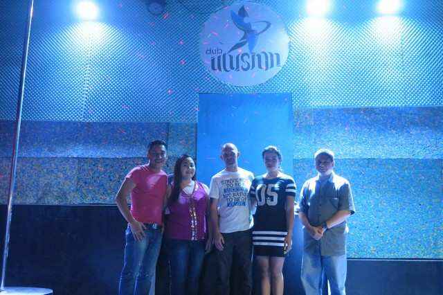 Team Acadeo poses with Club Illusion's owners.