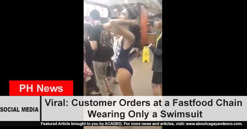 Customer orders at a fast food chain wearing only a swimsuit